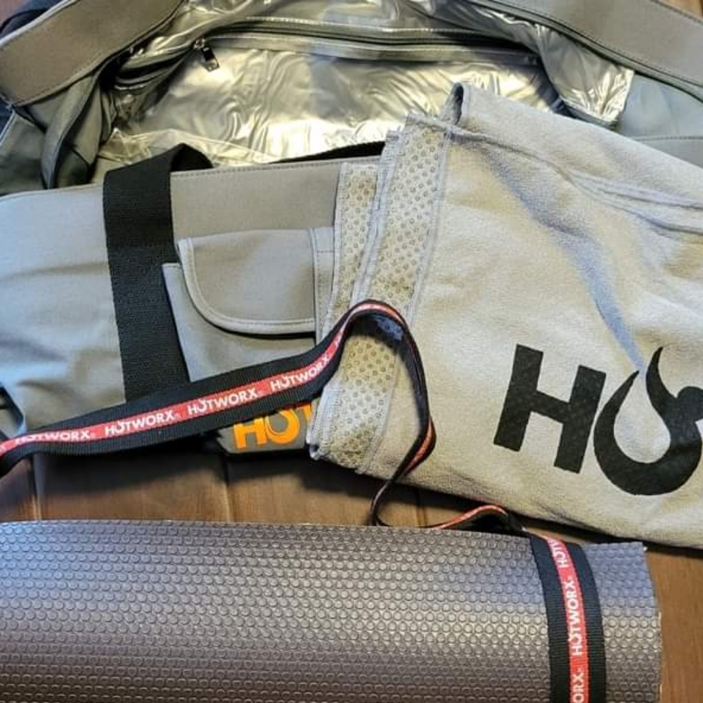 Hotworx bag, yoga mat with strap, and towel